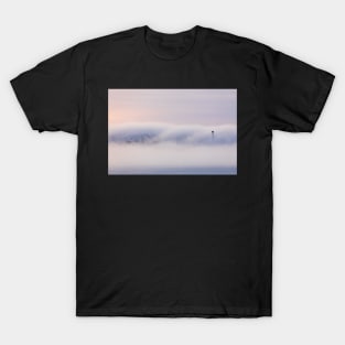 Dreamy thick fog at sunrise over hill T-Shirt